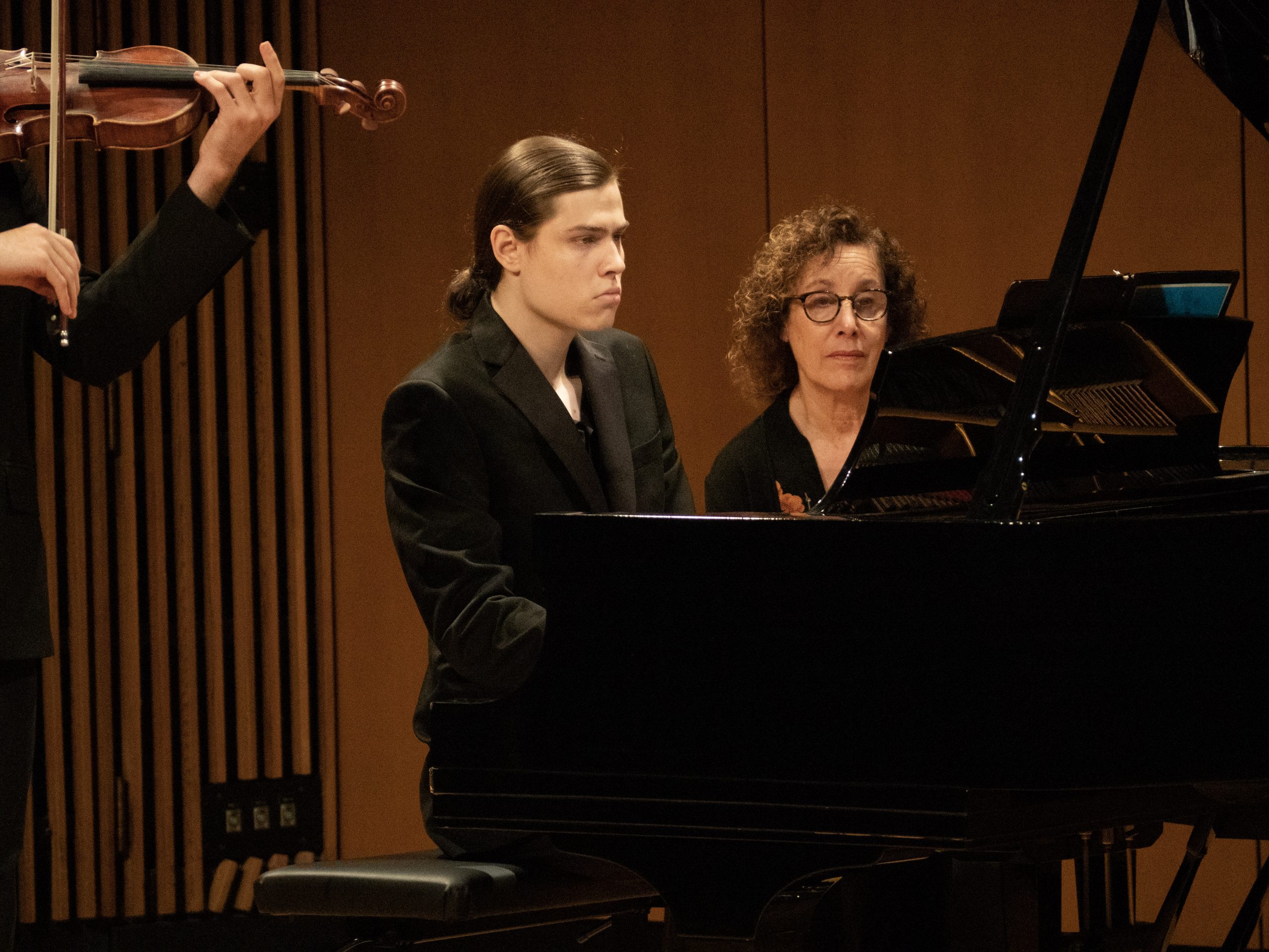 close up of hand playing piano
