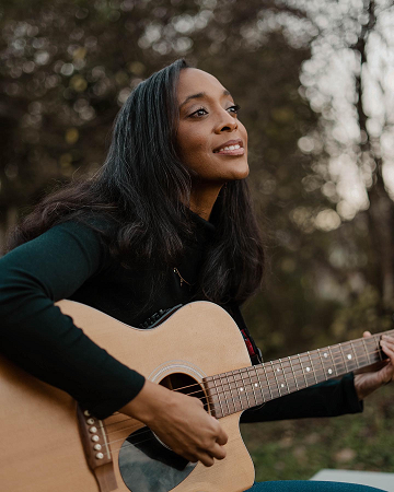 Courtney Ariel with guitar