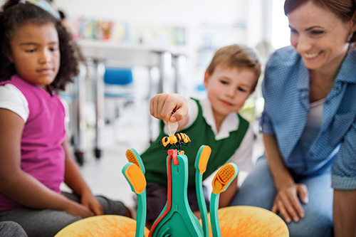 young boy with manipulative