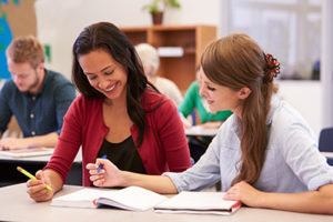 Two women working together at desk