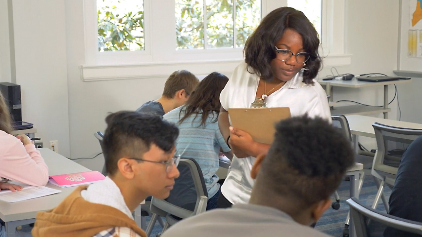 teacher circulating around classroom