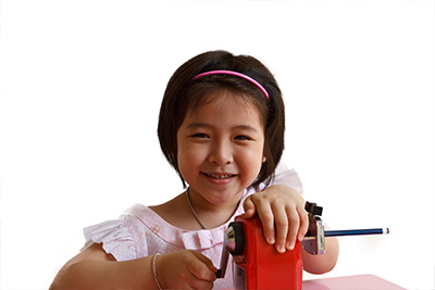 Emily sharpening her pencil