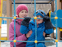 adult helping child climb