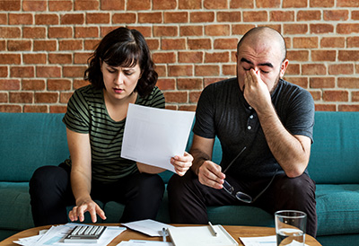 couple exhibiting financial stress