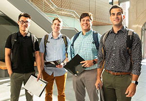 Four male students in VUSN's atrium 