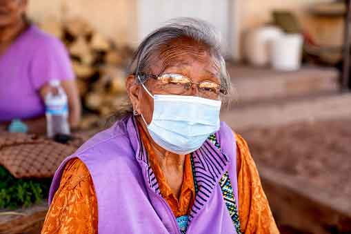 Older Navajo woman wearing a mask to avoid COVID