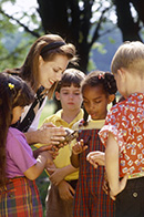 Teacher showing students a turtle