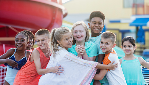 group of diverse young students on the playground