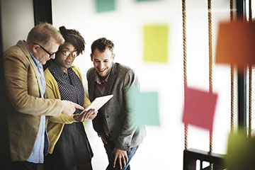 adults meeting and reading a paper