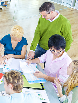 trainers meeting at table