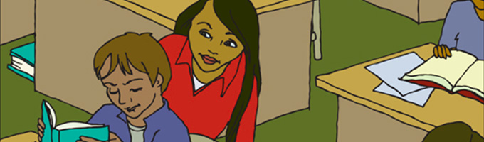 Teacher looking over a students shoulder