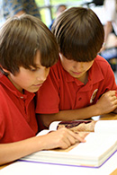 Two boys studying