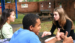 Three students talking