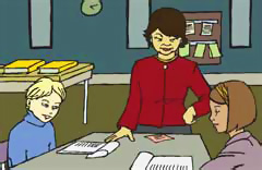 teacher standing by student at table