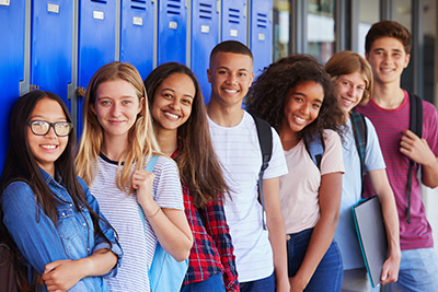 students in a group in the hallway