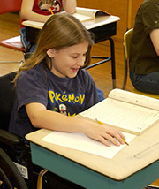 Happy girl at her desk