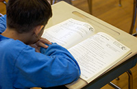 Boy reading at his desk