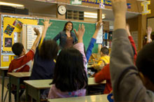 students raising hands