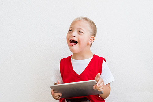 young boy with iPad