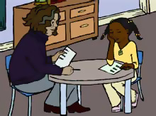 teacher and student at desk