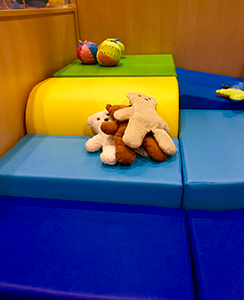 cushions on the floor and toys