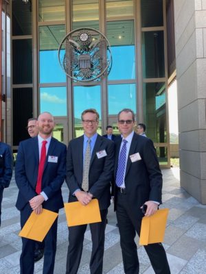 Brad Smith, Brett Benson, and Josh Clinton outside U.S. government office