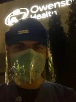 Clark taking a break outside the Owensboro, Kentucky, emergency room where he volunteered.