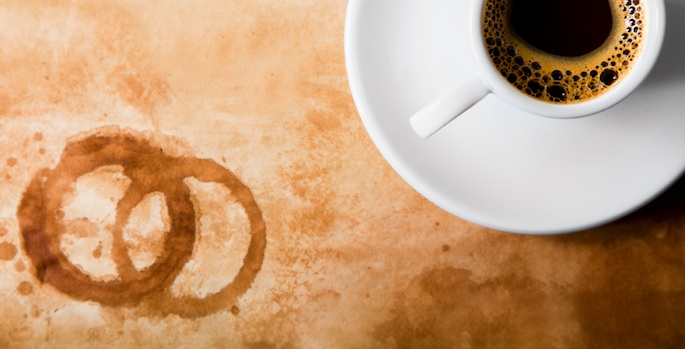 coffee cup with coffee stains on table