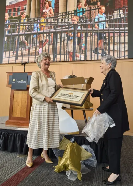 Presenting a gift to the Roberts family during the Roberts Academy Celebration. Photo: Harrison McClary/Vanderbilt University