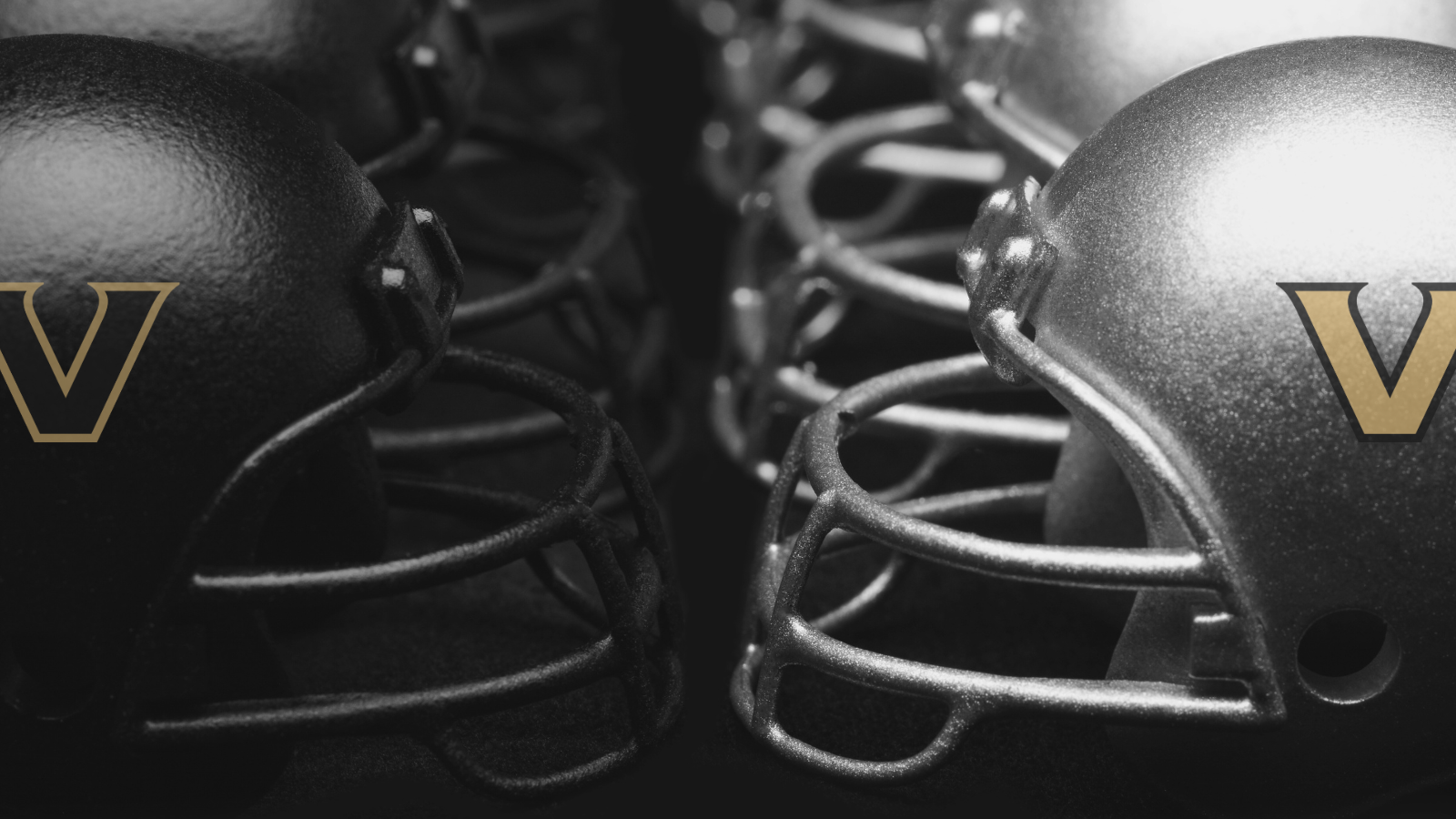 Football helmets with the Vanderbilt Athletics logo face each other, representing 'debate.'