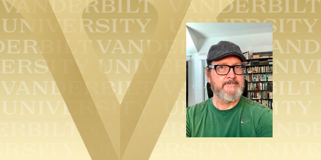 Mark Wollaeger head shot on gold Vanderbilt background (Vanderbilt University)