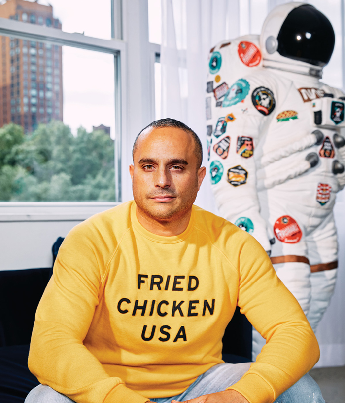 photo of Joe Ariel next to a "gastronaut" space suit