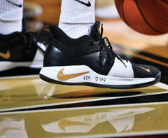 photo of basketball shoes with "DW" written on them