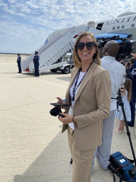 Lauren Egan stands near an aircraft on a trip to South Carolina.
