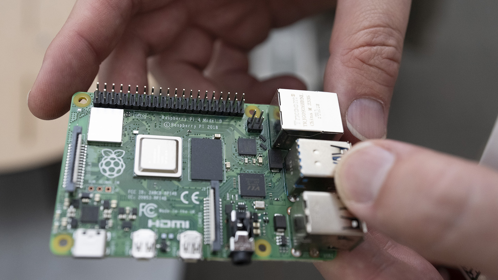 Bennett Landman holds a computer motherboard