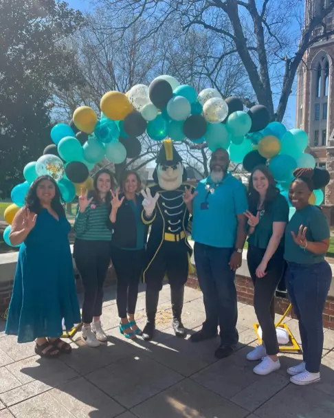 Project Safe staff with Mr. C during Sexual Assault Prevention Month