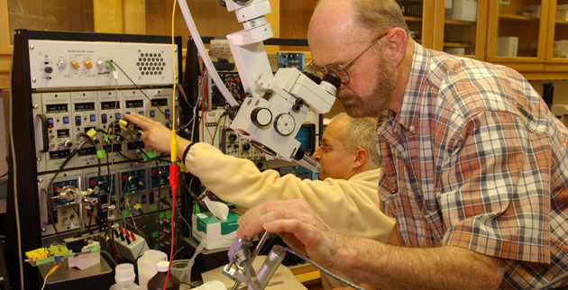Ford Ebner (foreground), professor of psychology, emeritus, in the animal lab in Wilson Hall. (Vanderbilt University)