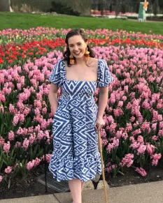 Mary Cayten Brakefield wears one of her inclusive designs, which has pockets that have holes for threading the cording of an external medical device. (Submitted photo)