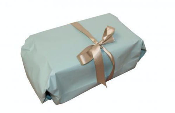 a box sloppily wrapped in light blue paper with a badly tied gold bow