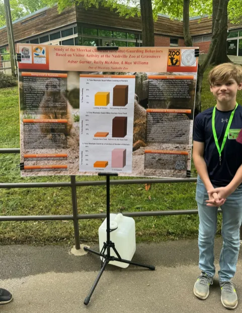 Day of Discovery student presenting poster at the Nashville Zoo