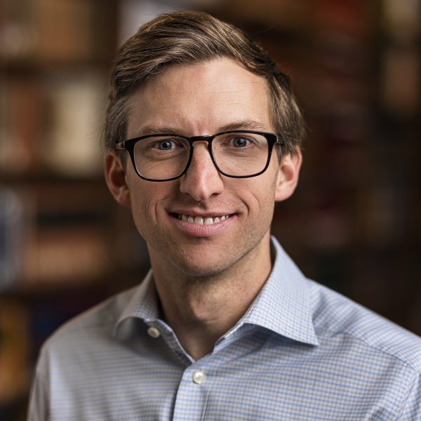 Headshot of a man wearing glasses