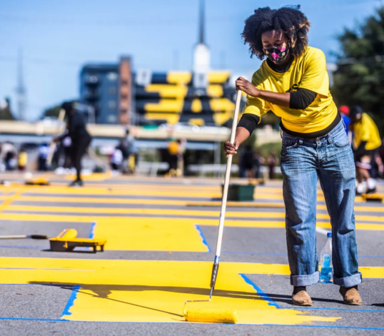 Megan Jordan paints a Black Lives Matter road mural in Nashville. (Submitted photo)
