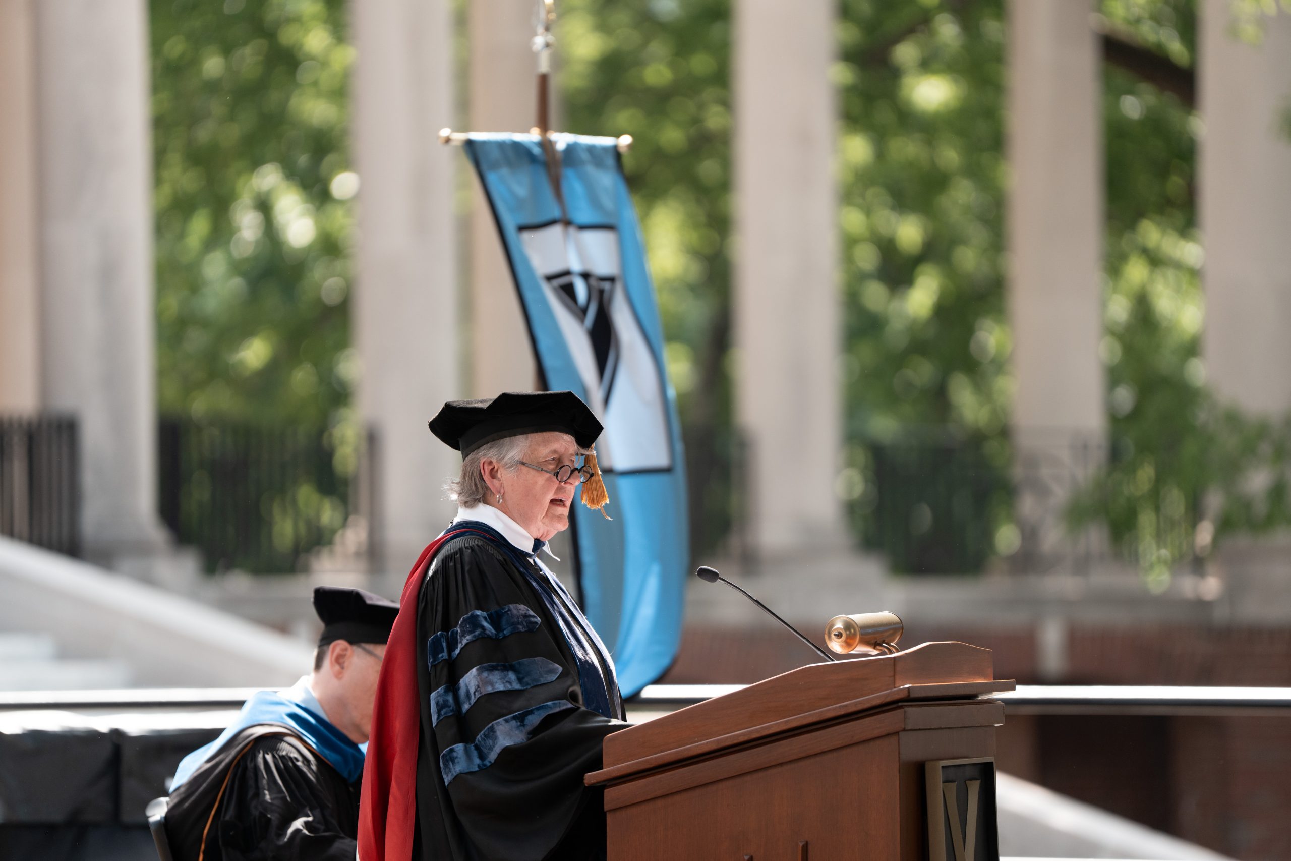 Sharon Shields giving speech at podium at Commencement, May 9, 2025