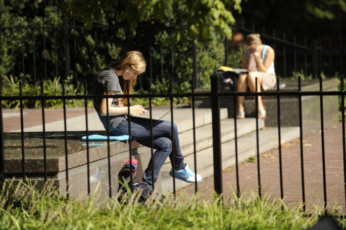 Students study on their laptops outside of Buttrick Hall (John Russell/Vanderbilt University)