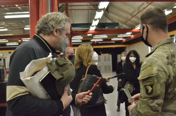 Chancellor Diermeier looks at the stake assembly and removal, or STAR, hammer, developed through a partnership between 101st Airborne Division (Air Assault) Soldiers and Vanderbilt researchers. The tool was designed to reduce physical exhaustion, improve recovery times and cut back on damage to camo nets from current stake removal practices. (Ethan Steinquest, Fort Campbell Courier)