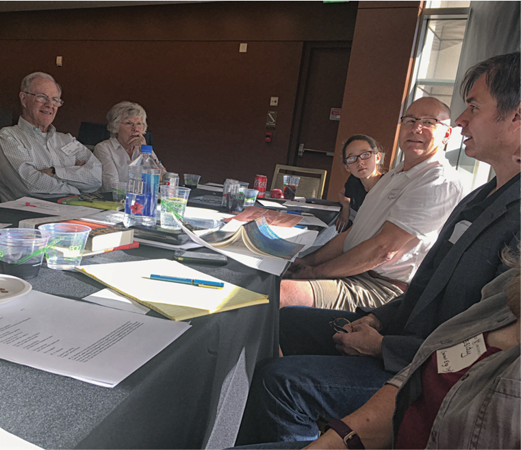 Rick Hilles, far right, leads a writing workshop seated next to Steve Garrison and his daughter.