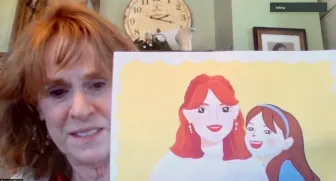 Laurie Woods, MLAS’00, MA’02, PhD’08, senior lecturer in sociology shows off artwork Chen made of Woods and her granddaughter.