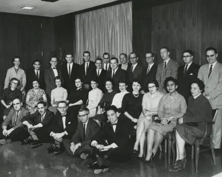 Group photo of members of the Pi Gamma Mu national honorary social sciences fraternity. First row, left to right: Emanuel Cheros, Robert Bahnsen, Roscoe Perritt, B.R. Coleman, Rolando A. Santos. Second row, left to right: Helen Post, Edla Oliveira, Harriett Farmer, Betty Payne, Llewellyn Hiott, Jo Ann Bartlett, Glenn Dixon, Marjorie Haden, Jane Rush, Cecilia Pastrana, Anna L. Knox. Third row, left to right: Marjorie Tusk, Winai Kasemsestha, Elliott Stabler, James Sasser, J.B. Tate, Jack Morgan, Robert Polk Thomson, Norman Friedman, Robert Bjork, Jewel Phelps, Kenneth Cooper, Norman Stedman, Bob Stewart, E. Wayne Keith.