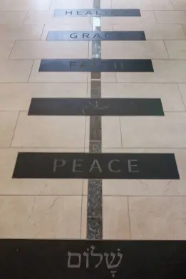 A blue granite pathway is intersected by 12 black granite tiles engraved with words that exemplify the Divinity School’s mission. (Anne Rayner/Vanderbilt)