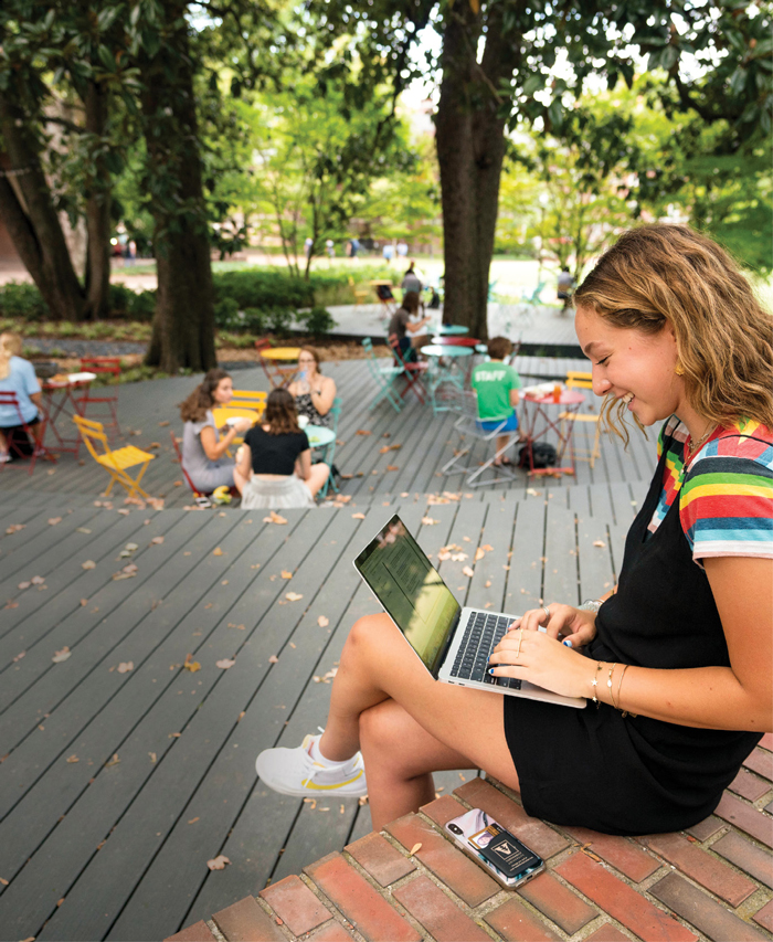 photo of students studying and talking on the Fleming Yard deck